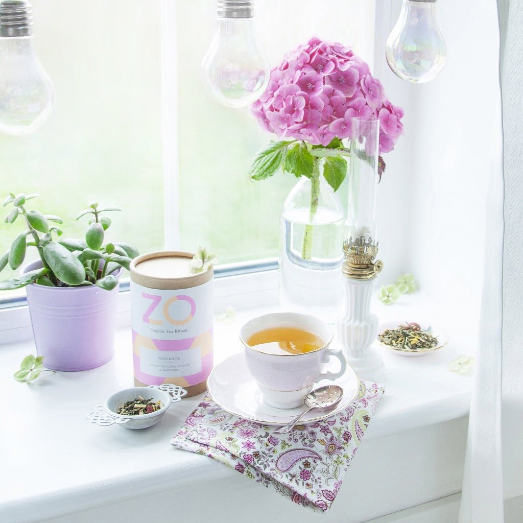 Organic loose leaf tea in a cup on a window cil